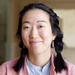 A woman with dark hair in pigtails